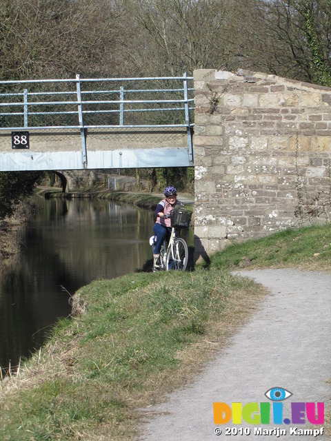 SX12833 Jenni riding her new bike underneath canal bridge